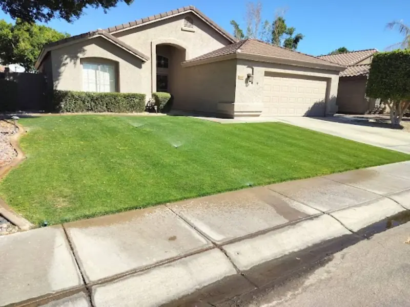Maintained front lawn and landscape by Arrowscape